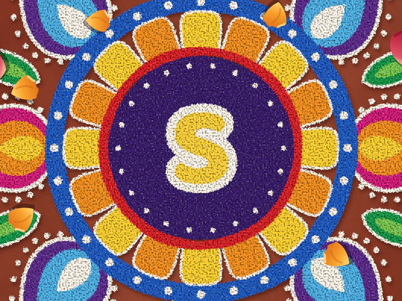 The Sharma family's initials at the heart of a rangoli, close up